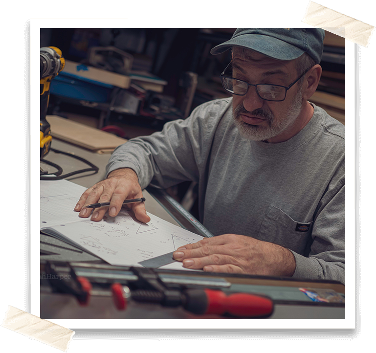 A man working on paper in an office.