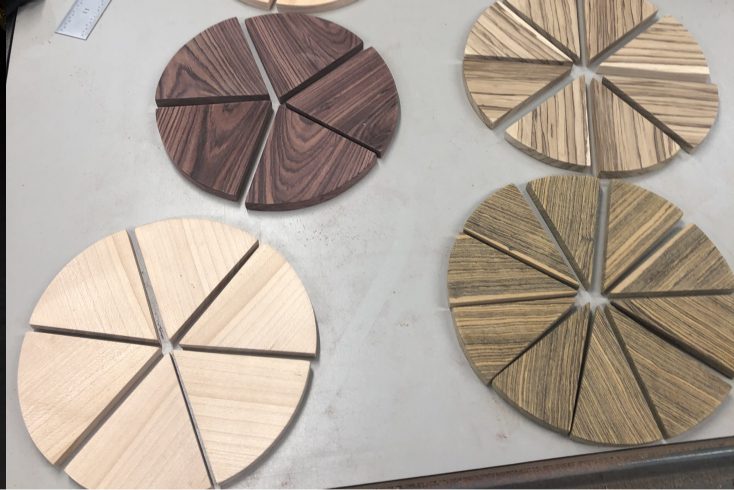 A table with wooden slices arranged in circles.