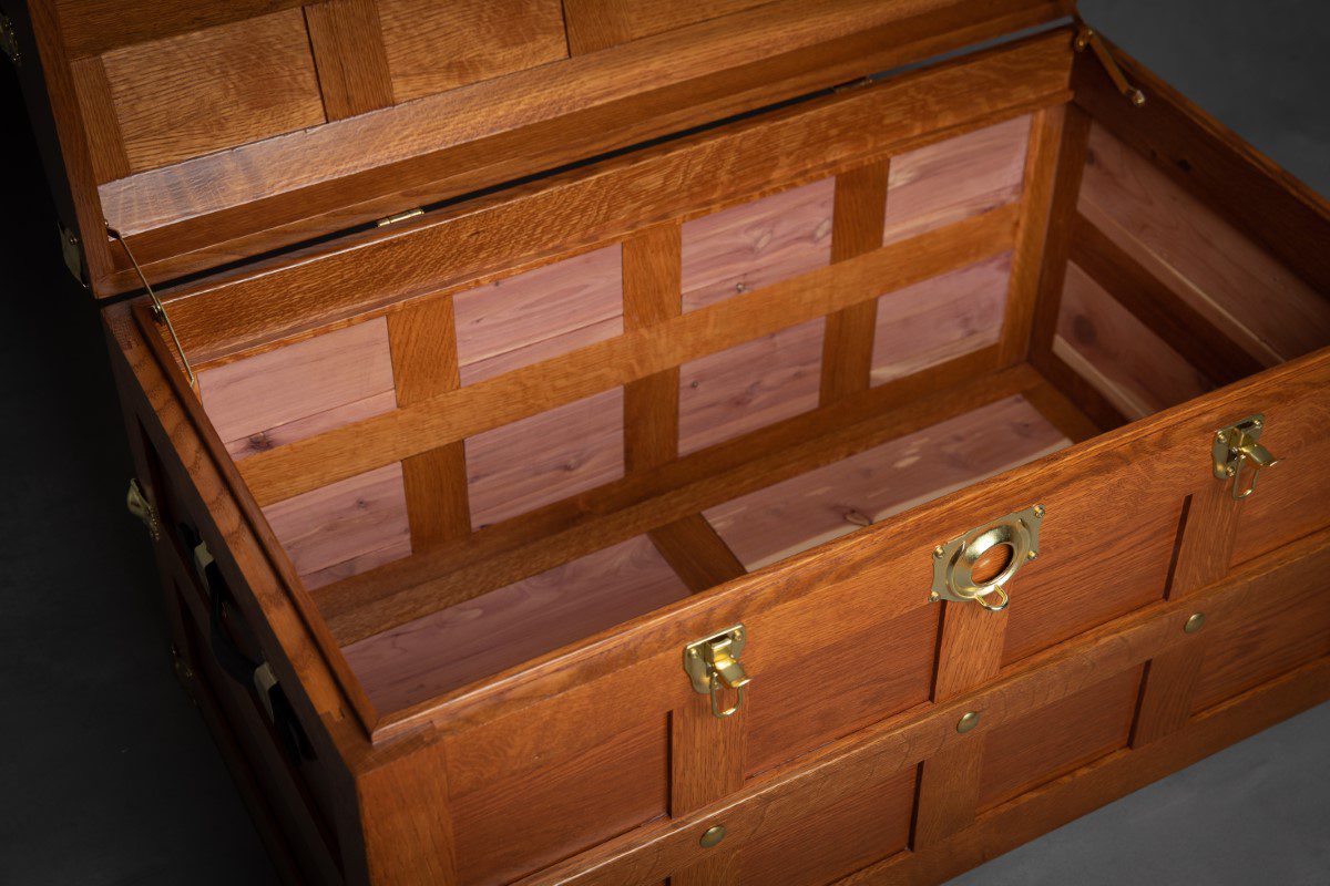 A wooden chest with two drawers and one lid.