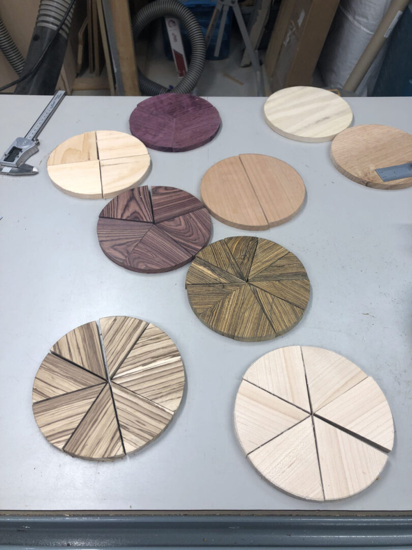 A table with several different wooden discs on it.