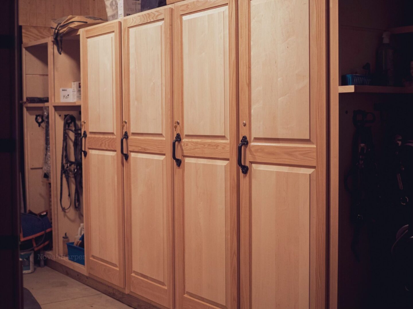 A large wooden cabinet with doors and drawers.