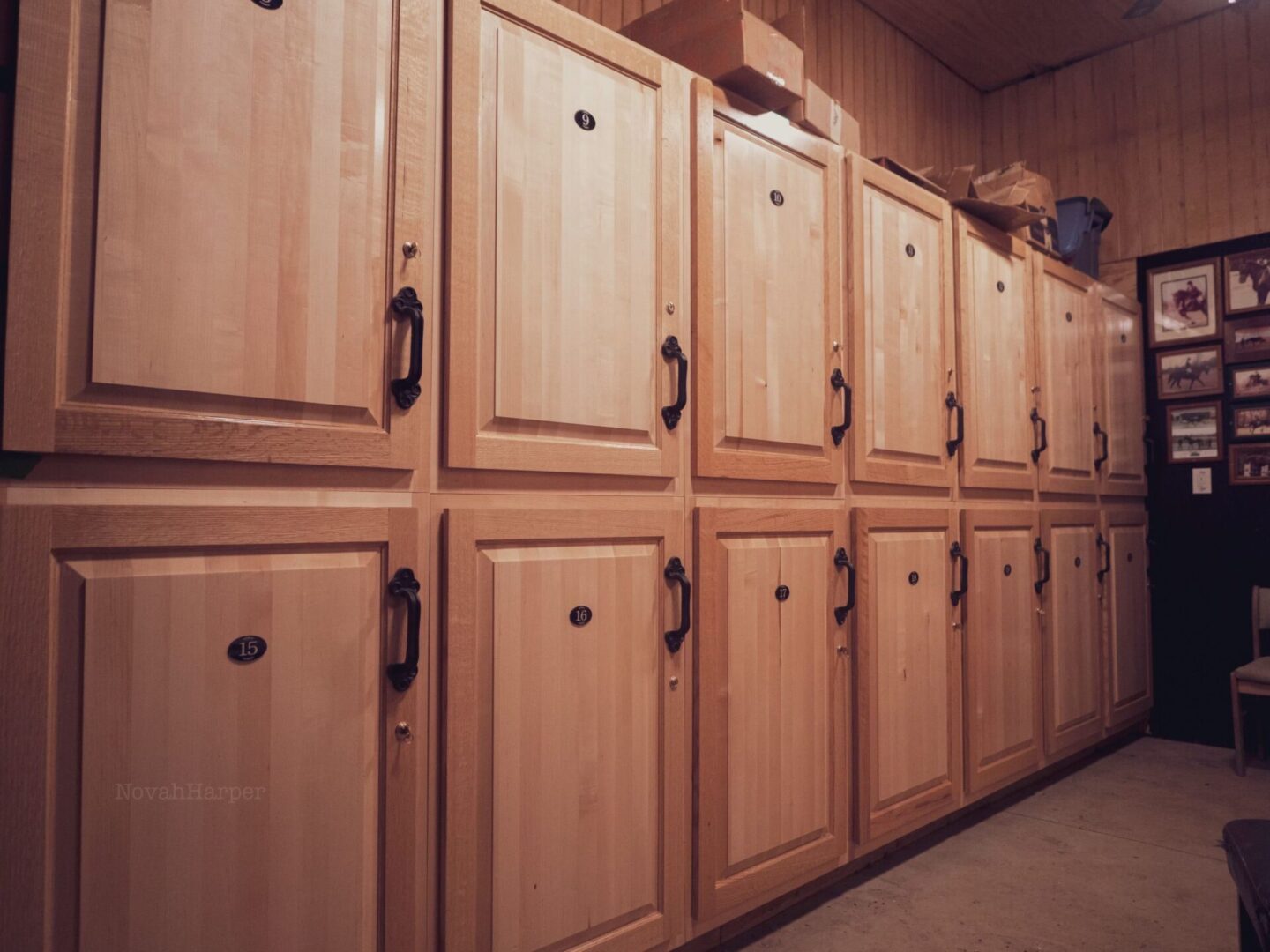 A room with many wooden cabinets and shelves.