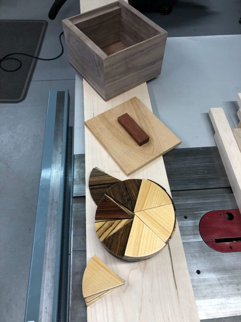 A table with some wooden blocks and a pie